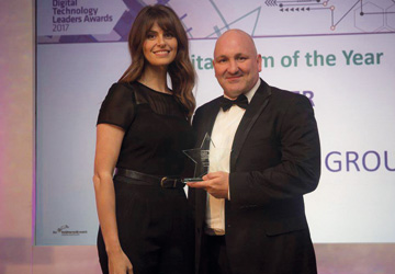 a man and a woman dressed up holding an award