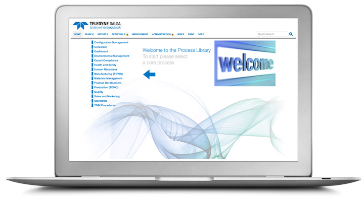 a laptop displaying TELEDYNE DALSA's process library with blue text and a blue welcome sign 