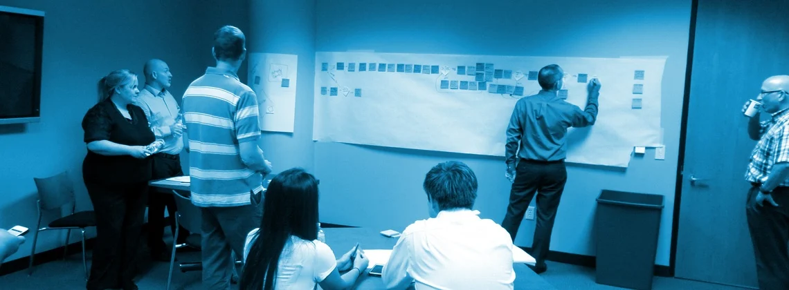a process mapping workshop in a blue wash